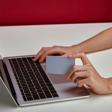 Person at a laptop making an online payment